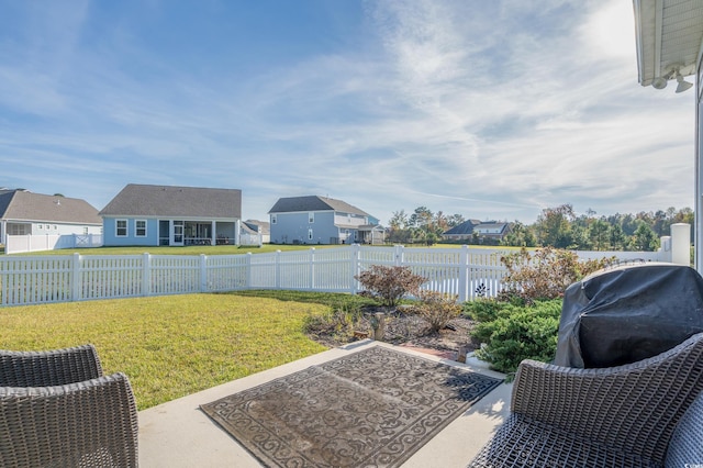 view of yard with a water view and a patio