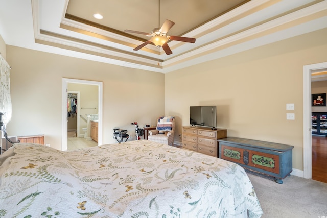 bedroom featuring a raised ceiling, ceiling fan, and crown molding