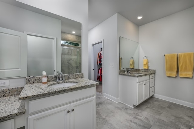 bathroom with vanity and walk in shower