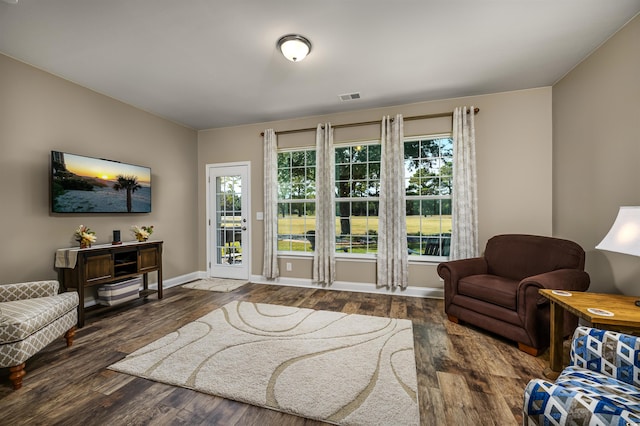 living room with dark hardwood / wood-style flooring