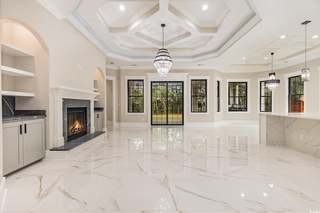 unfurnished living room featuring plenty of natural light, crown molding, and coffered ceiling