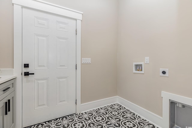 laundry area featuring tile patterned flooring, hookup for a washing machine, and electric dryer hookup