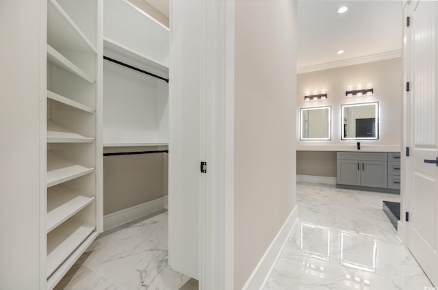 bathroom featuring vanity and ornamental molding