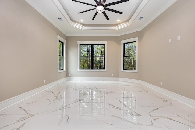 unfurnished room with ceiling fan, crown molding, and a tray ceiling