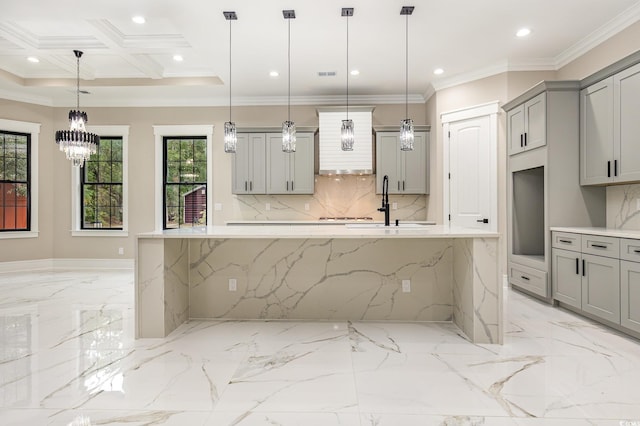 kitchen with pendant lighting, backsplash, gray cabinets, and crown molding