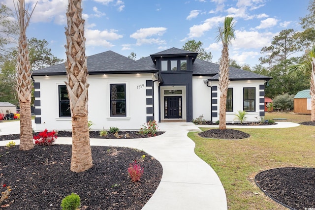 prairie-style house with a front lawn