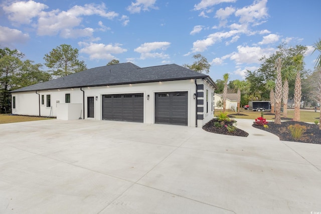 view of side of home with a garage