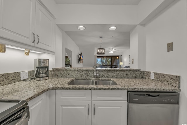 kitchen featuring light stone counters, stainless steel appliances, ceiling fan, sink, and white cabinets