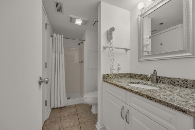 bathroom with tile patterned floors, vanity, toilet, and a shower with shower curtain