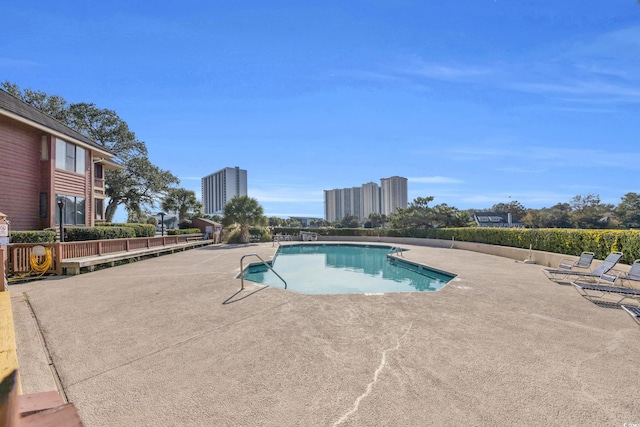 view of pool featuring a patio area