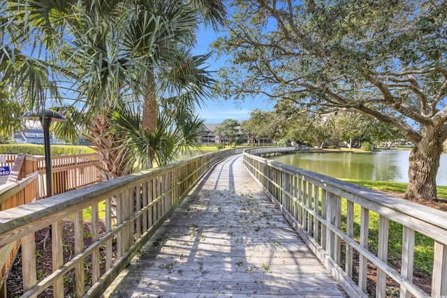 surrounding community featuring a water view