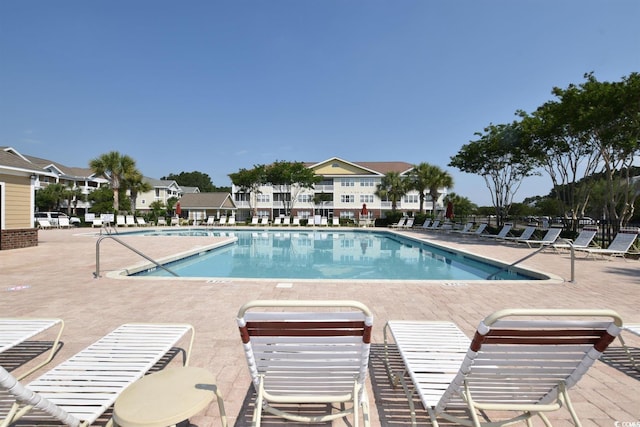 view of swimming pool with a patio area