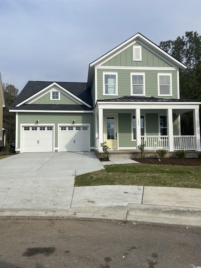 view of front of property with covered porch, board and batten siding, concrete driveway, and an attached garage