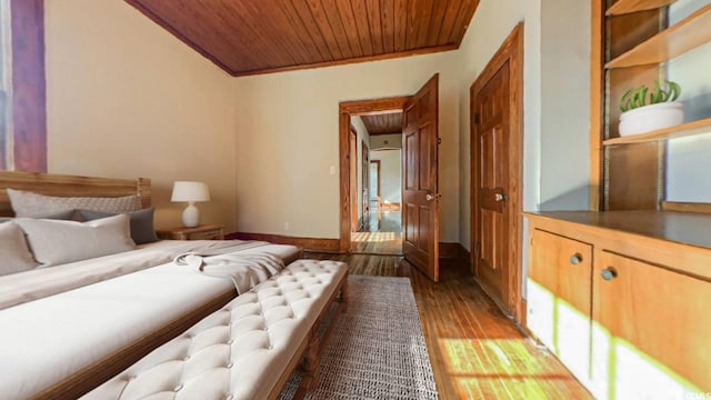 bedroom with wood-type flooring, crown molding, and wooden ceiling