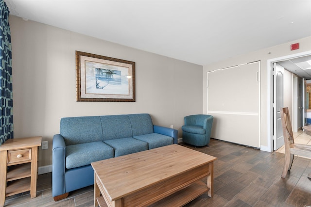 living room with dark hardwood / wood-style floors