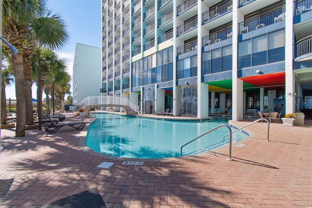 view of swimming pool with a patio