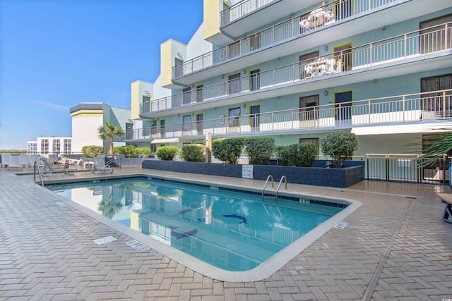 view of swimming pool featuring a patio