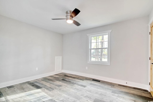 1409 Woodhaven Rd, Latta, SC 29565 - empty room with wood finished floors and a ceiling fan