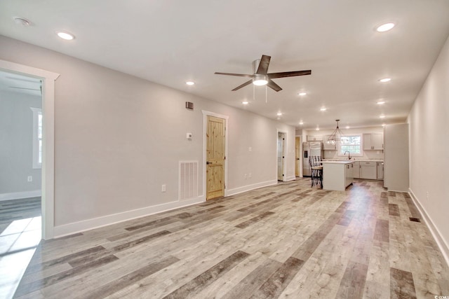 1409 Woodhaven Rd, Latta, SC 29565 - unfurnished living room with ceiling fan, light wood-style flooring, and recessed lighting