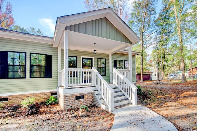 view of front of property featuring covered porch