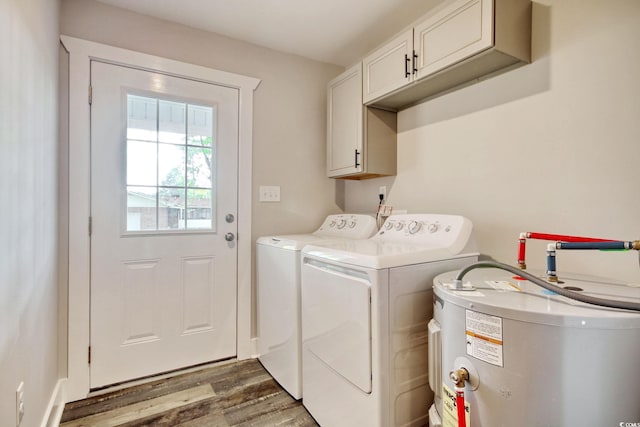 1409 Woodhaven Rd, Latta, SC 29565 - laundry area featuring water heater, cabinet space, separate washer and dryer, and wood finished floors