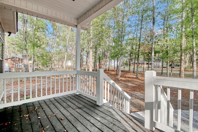 1409 Woodhaven Rd, Latta, SC 29565 - wooden porch featuring view of wooded area