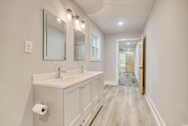 1409 Woodhaven Rd, Latta, SC 29565 - bathroom featuring wood finished floors and double vanity