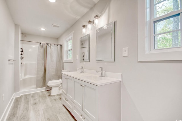 1409 Woodhaven Rd, Latta, SC 29565 - bathroom with a shower with curtain, double vanity, recessed lighting, and wood finished floors