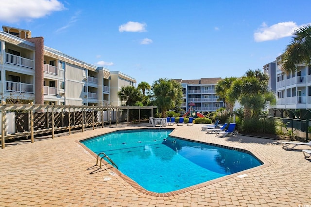 view of swimming pool featuring a patio