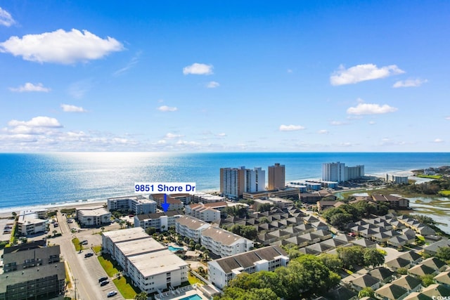 aerial view with a water view and a view of the beach