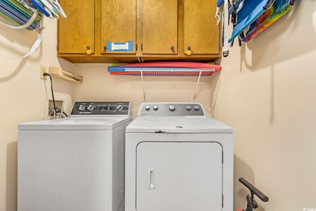 laundry area featuring cabinets and washer and dryer