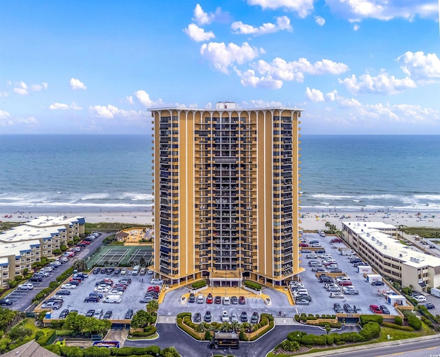 birds eye view of property featuring a view of the beach and a water view