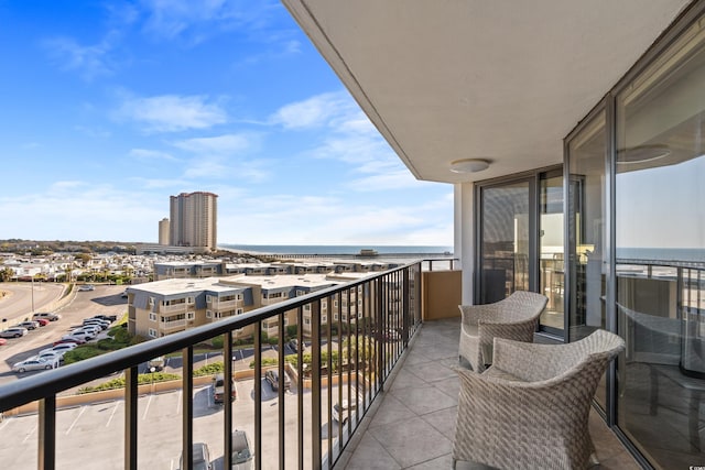 balcony featuring a water view