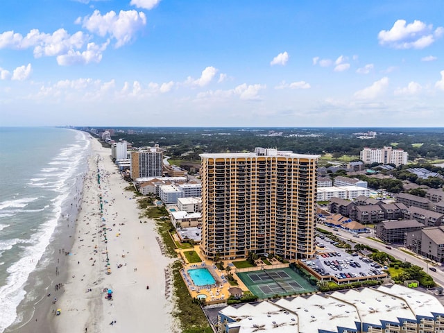 drone / aerial view featuring a water view and a beach view