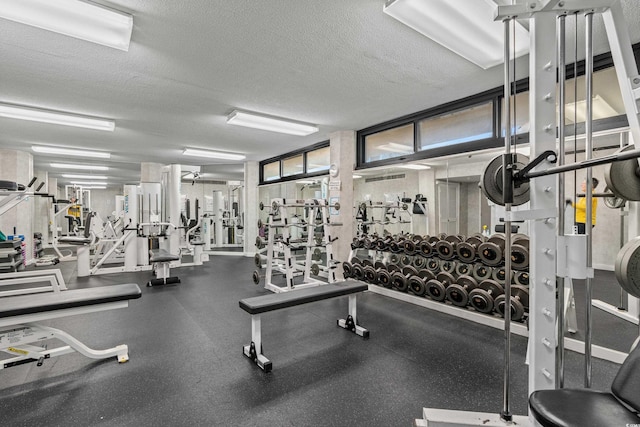 gym featuring a textured ceiling