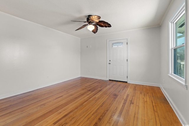 spare room featuring ceiling fan, crown molding, and hardwood / wood-style floors