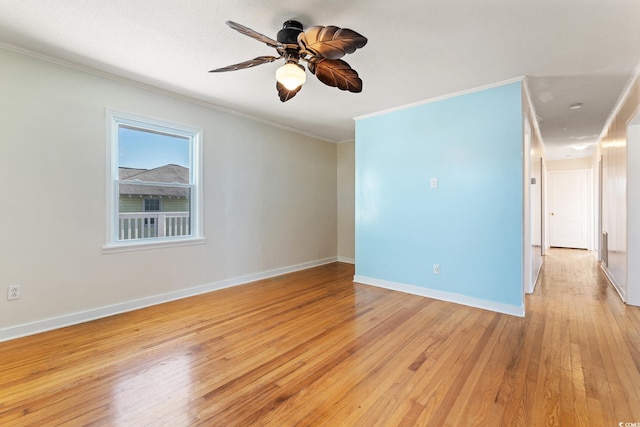 spare room with ceiling fan, ornamental molding, and light hardwood / wood-style floors