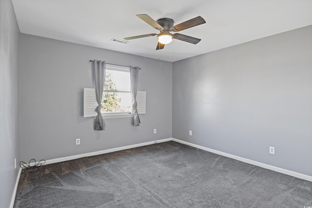 carpeted spare room featuring ceiling fan