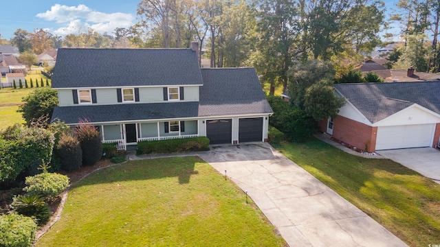 view of front of home featuring a front lawn and covered porch