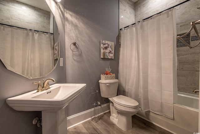 bathroom featuring hardwood / wood-style floors, toilet, and shower / bath combo