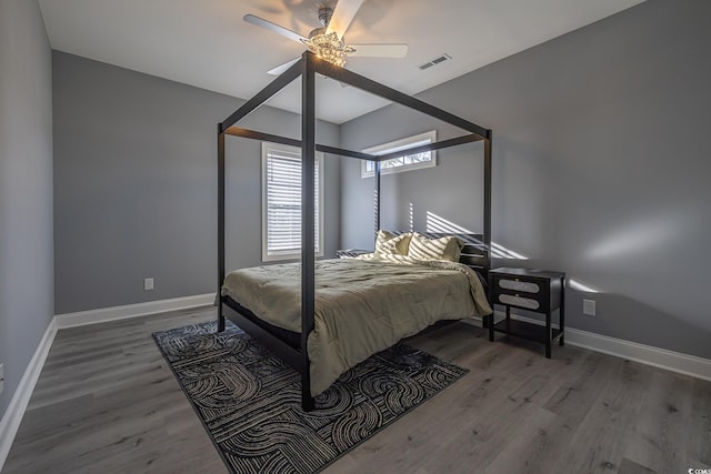 bedroom with hardwood / wood-style flooring and ceiling fan