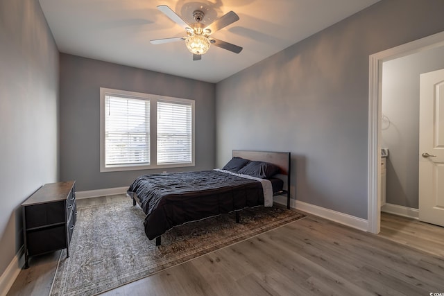 bedroom with hardwood / wood-style floors and ceiling fan