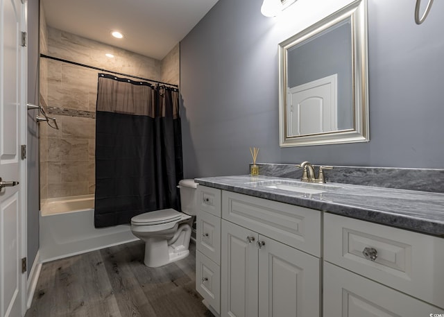 full bathroom with vanity, shower / bath combination with curtain, toilet, and wood-type flooring