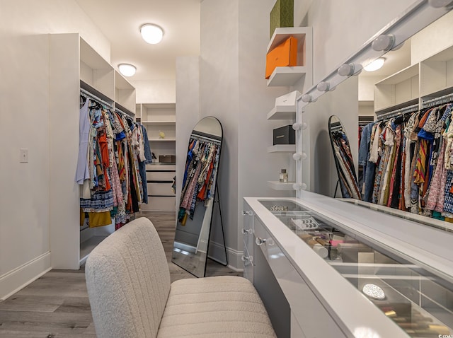 spacious closet featuring light hardwood / wood-style floors