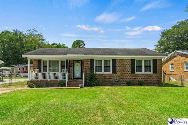 single story home with covered porch and a front lawn