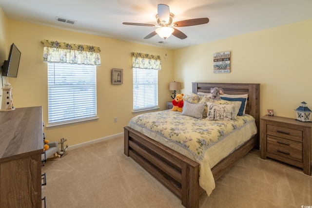 bedroom featuring ceiling fan and light colored carpet