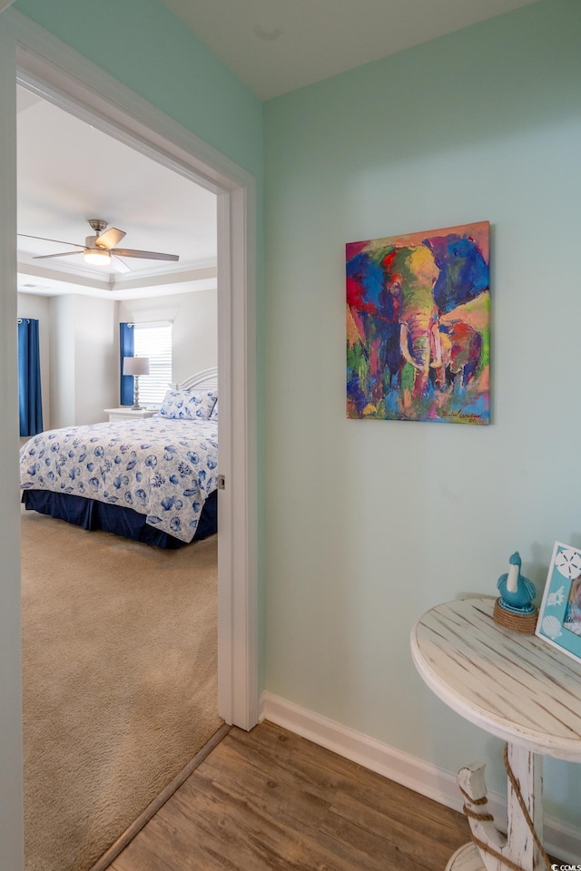 bedroom with hardwood / wood-style flooring and ceiling fan