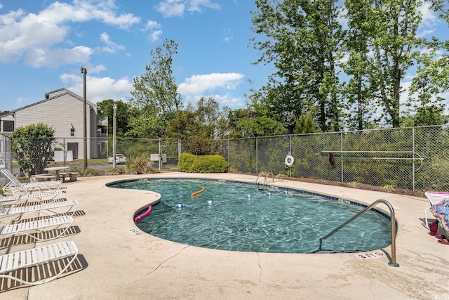 view of swimming pool with a patio area