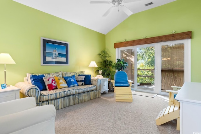 carpeted living room with ceiling fan and lofted ceiling