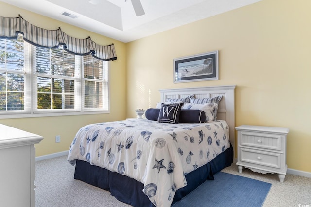 bedroom with light carpet and ceiling fan